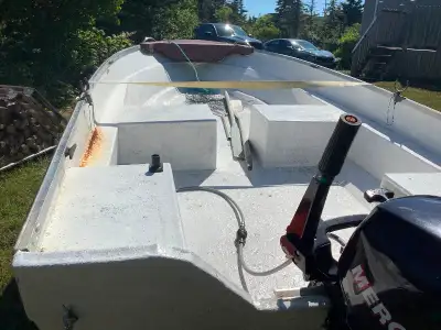 14 ft. fibreglass boat …. 9.9 mercury 4 stroke motor and an easy hauler trailer with electric wench.