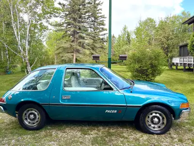 1976 AMC Pacer X Rare Marine Aqua Metallic with white interior. Very neat and tidy car Glass is all...