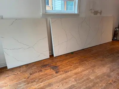 White and grey calacatta marble style quartz. Used for a year. 2 pieces - 10’4” x 46” - 3’8” x 46” O...