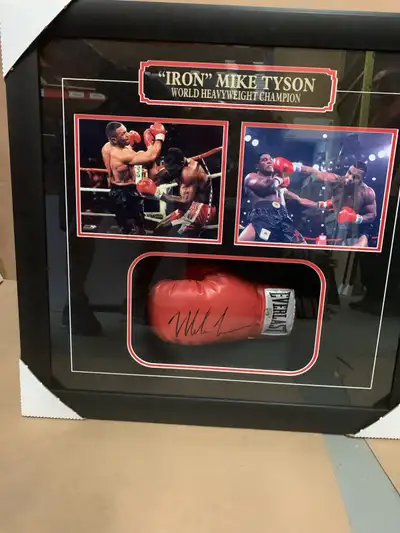 Brand new , professionally framed full size boxing glove. Autographed by “iron” Mike Tyson. Direct f...