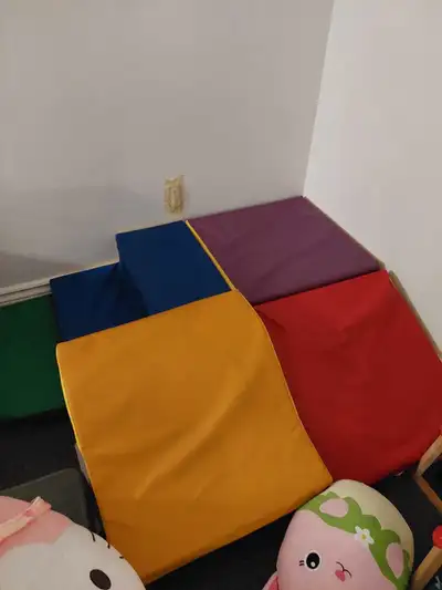 From Amazon. Comes with stair, block, ramp, slide and two green soft curved parts. Connects with vel...