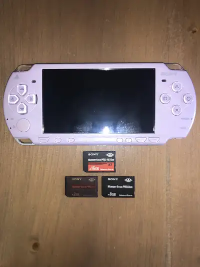 Great shape console with 2GB, 8GB and 16GB memory sticks, needs a battery and charger