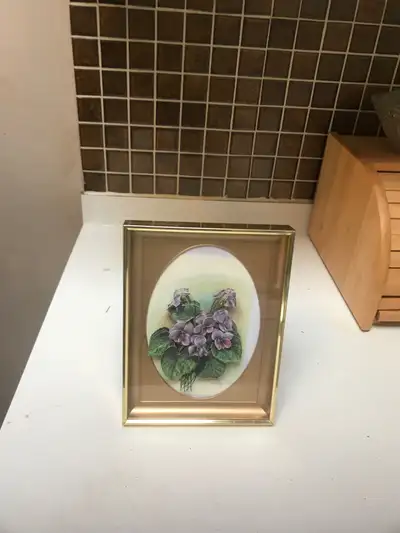 Here is a charming decorative handmade framed picture featuring African Violets. It adds a touch of...