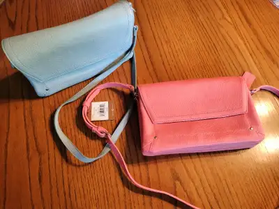Two new Denver Hayes faux leather purses, one coral, one powder blue. Regular price $39.99 + HST. Se...
