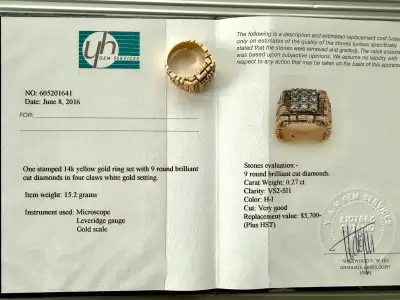 This exquisite 14k yellow gold ring showcases 9 round brilliant cut diamonds, elegantly set in four-...