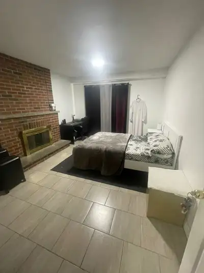a large room furnished on the mai n floor has access to the patio all utilities included in the hear...