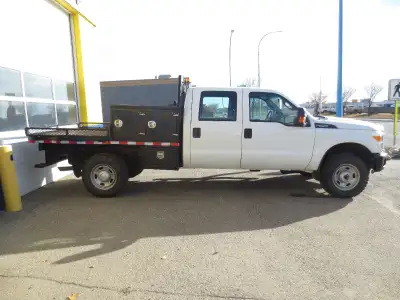 4x4 crewcab flat deck with tool boxes has new tires rad and new paint on deck