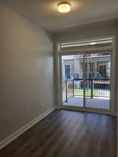 Stacked townhouse 3 Beds 2 full Baths in Barrhaven, ON, Main floor has 2 bedrooms 1 full bathroom an...
