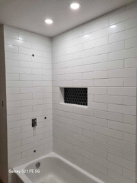 Installation of tiles and stone.