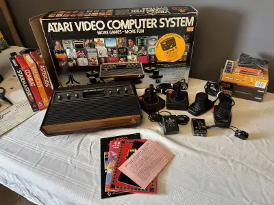 BOXED ATARI 2600 WITH ALL HOOK UPS AND GAMES, View more