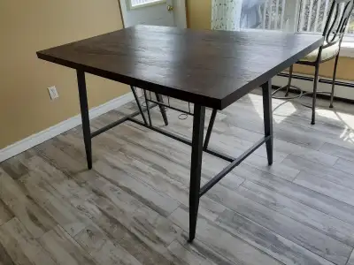 Used kitchen bar table (no chairs included). Measurements: 60" long, 36" wide, 36" high.