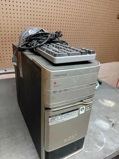computer tower and 2 keyboards, View more