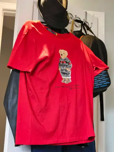Check out this vibrant, pre-loved Polo Ralph Lauren T-shirt, featuring the iconic Polo Bear, ready t...