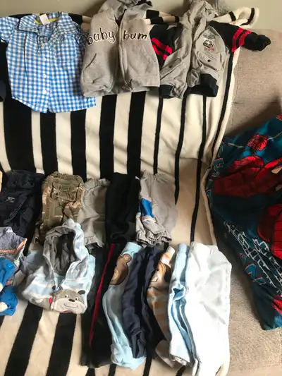 11 sweaters, one jean jacket, one over alls. 15 pairs of pants, 12 shirts, 8 socks and a pair of boo...