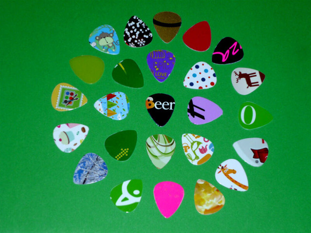 25 Guitar Picks ... Have one of a Kind .. As shown in Guitars in Cambridge