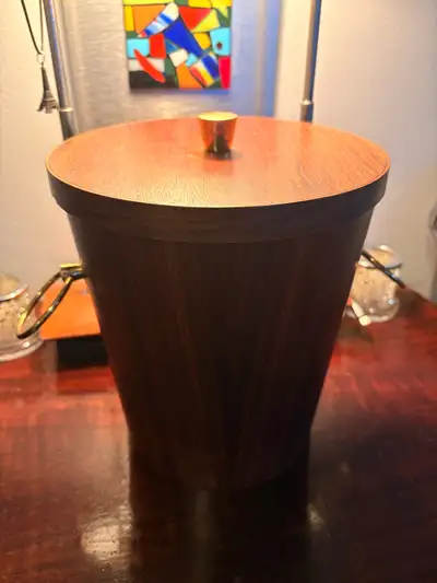 Delightful MCM Scandinavian teak ice bucket. This 1960’s retro barwawe piece features a stylish teak...