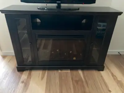 TV stand. 36” tall x 55” wide x 15” deep. Has a built in electric fireplace. Not currently working -...