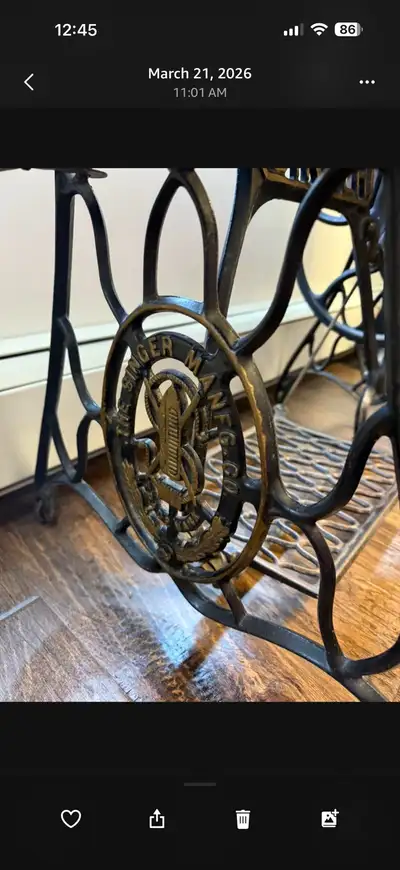 1930 Singer in original stand that has wheels. Needs a belt to make it work and the stand has some s...