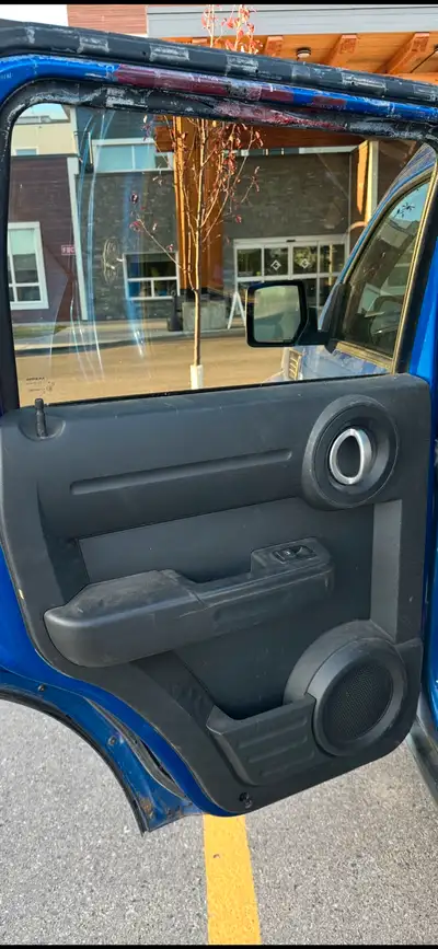 Have a rear drivers door for a dodge nitro . This door is bare and blue in color . Will post a bette...
