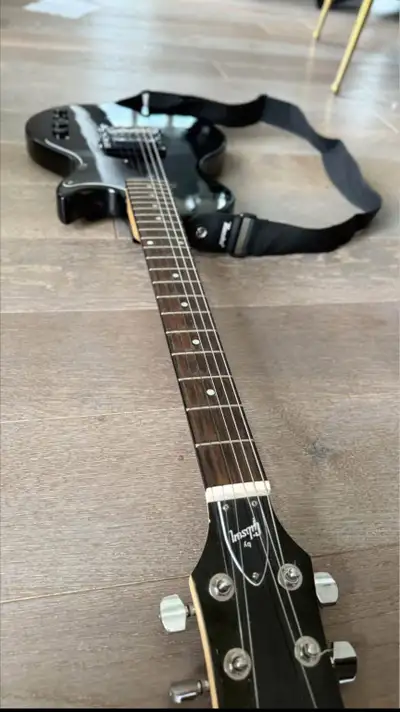 Black Maestro LP shape electric guitar with amp, View more