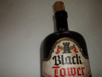 Vintage black tower crock bottle