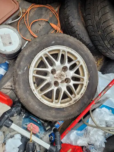 4 rims with tires for sale....tires are old, rims still good 120 obo