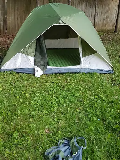 Used Aglory 4 person tent, it is a 3 season with a rain fly. The tent measures 9 x 7 feet, with a 55...