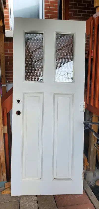 porte très pesante en bois plein largeur 86cm hauteur 209cm epaisseur 5.5cm une vitre le thermos est...