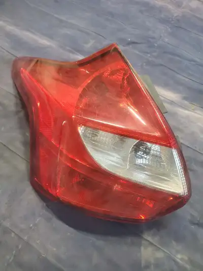 Left tail light off 2013 ford focus. Bottom has a little ship