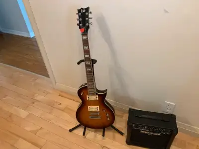 Guitar and small practice amp., View more