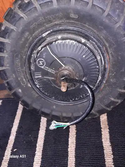 This is a used electric scooter wheel with motor, perfect for a DIY project or replacement. The whee...