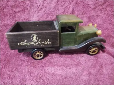 This is a charming, used Laura Secord wooden truck, perfect as a decorative piece or a unique gift....