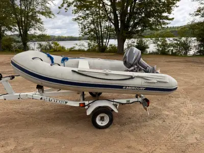 Mercury 4 person rigid hull inflatable boat in great condition Come with newer Yamaha 9.9hp 2 stroke...