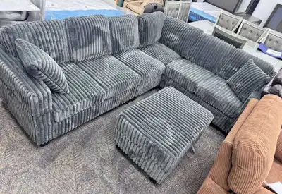 Upgrade your living space with this stylish grey corduroy sectional sofa that comes complete with a...