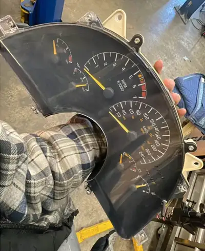 Cluster and bezel from 4th gen Pontiac Firebird, 243k km on it but you can have that rolled to match...