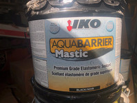 pails of mastic for roofing and waterproofing