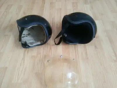 Selling 2 vintage helmets. Repainted black. Original colors underneath are metallic blue and metalli...