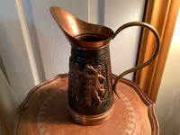 Vintage Embossed Copper Pitcher with a Brass Handle