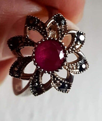 The silver ring with synthetic ruby and marquisate