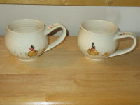 2 matching mugs made by artisan
