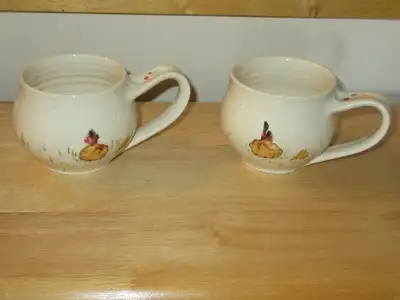 2 matching mugs made by artisan, View more