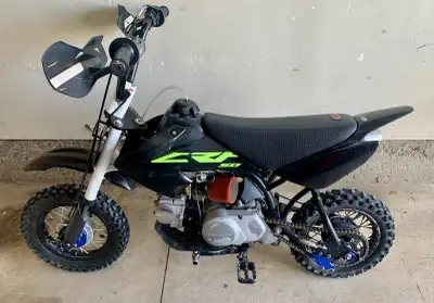 Honda CRF 50 pit bike, aftermarket handle bars with riser, tall seat, exhaust, air intake, foot pegs...