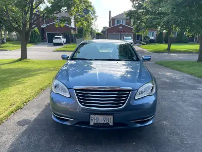 For Sale 2011 Chrysler 200 4 door Sedan Touring 2.4L. 20,000kms. Showroom condition. Contact 905 697...