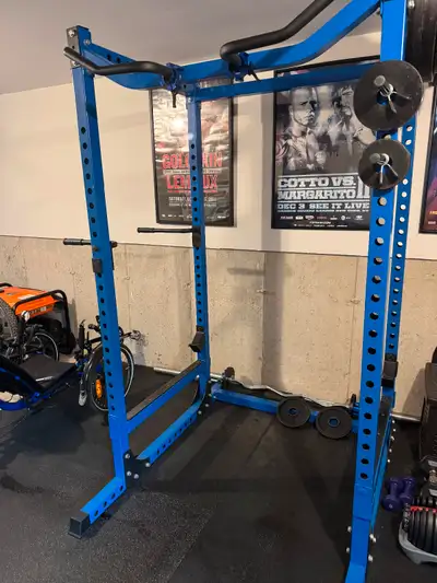 For sale solid steel squat rack fully adjustable with pull up bar, dip attachment. Easy curl bar and...