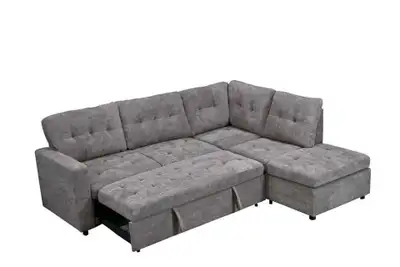 This used grey sectional sofa bed features a versatile design with a pull-out bed and storage ottoma...
