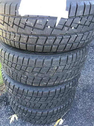 Under one season of use 225/60/R16 Tires are mounted on standard black steel rims. Ready to go.