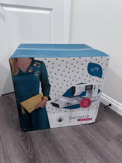 Bernette B79 Computerized Sewing and Embroidery Machine in brand new condition. My mother won it on...