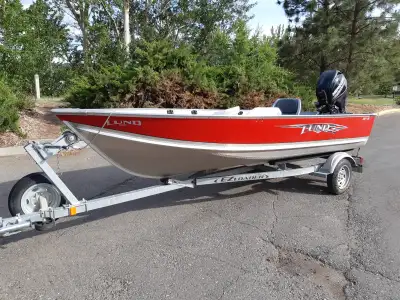 2016 Lund WC – 14 ft Fishing boat with ¾” marine-grade plywood floor and a 2016 EZLOADER 14 ft boat...