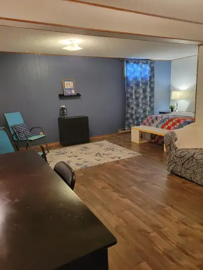 On bus route (#5). Near shopping and universities. Rent includes utilities and wifi. Deposit first a...