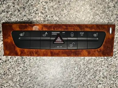 Hazard warning panel with heated seat, head rest, ESP and pax airbag control. Includes wood panel su...